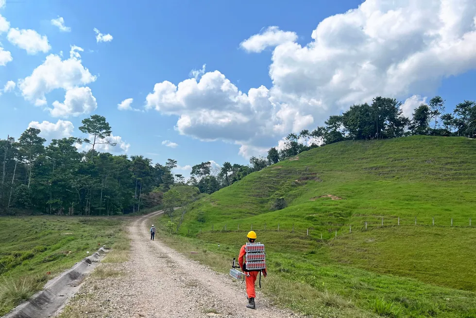 Deployment: Workers carrying Stryde nodes during an operation in Colombia.
