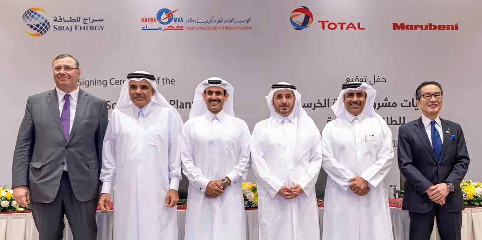 Total chief executive Patrick Pouyanné, far left, with consortium partners at a signing ceremony in January 2020.