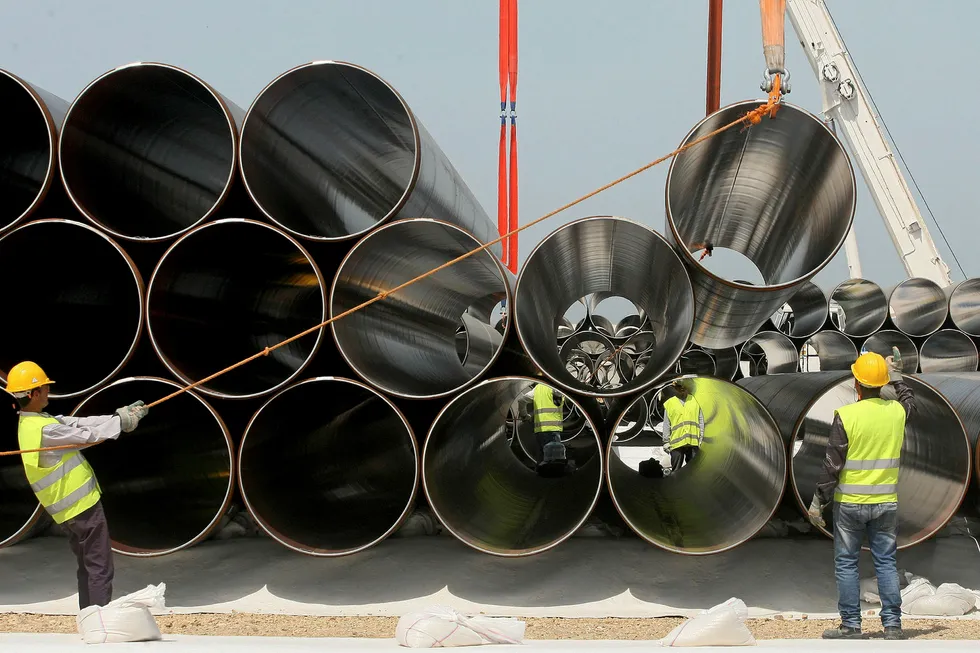 Near neighbour: workers unload newly arrived pipes in Spitalle, Italy, for the construction of the future Trans-Adriatic Pipeline