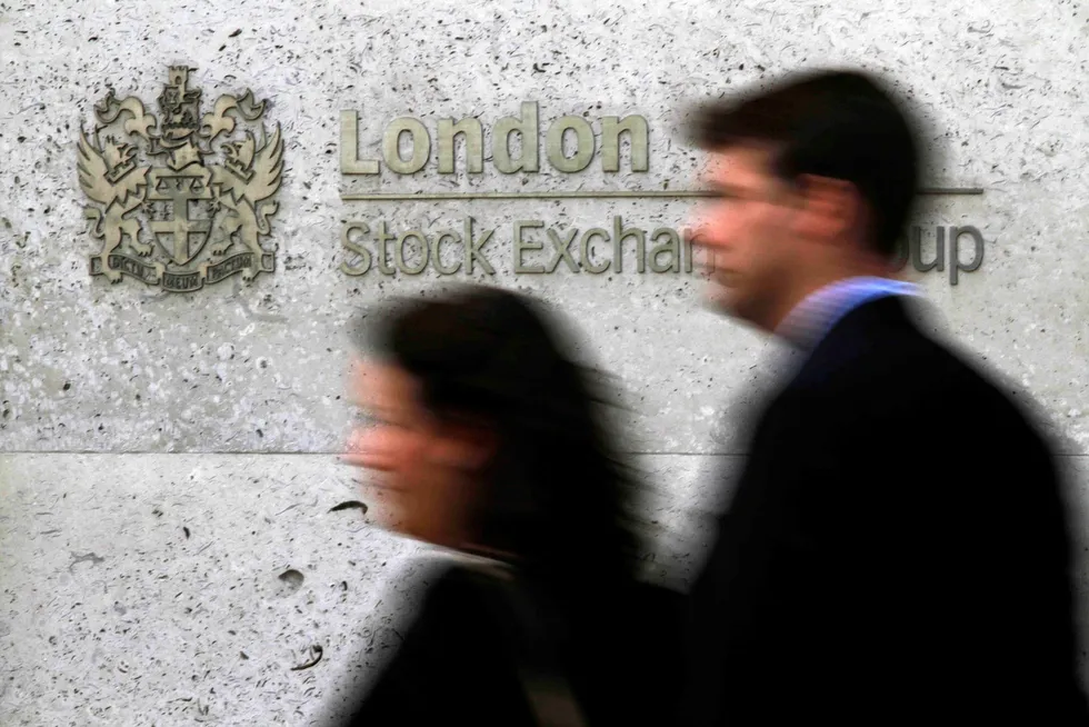People walking past London's Stock Exchange.