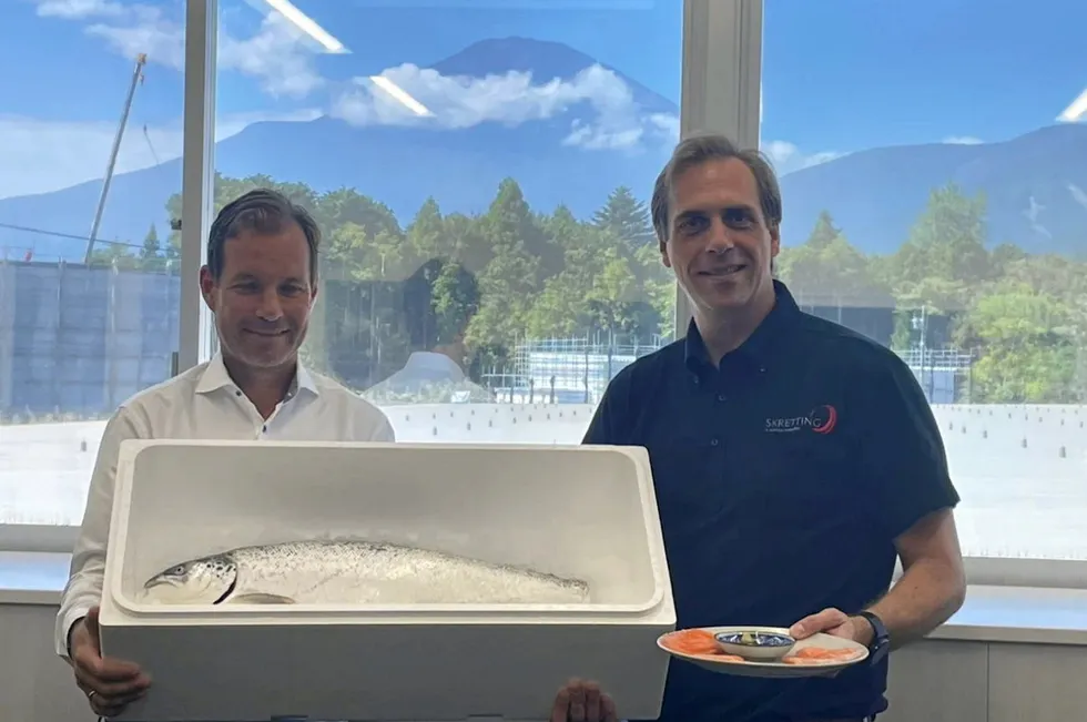 Proximar Seafood CEO Joachim Nielsen (left) and Skretting CEO Bastiaan van Tilburg with a fish produced near the foot of Mount Fuji in Japan.