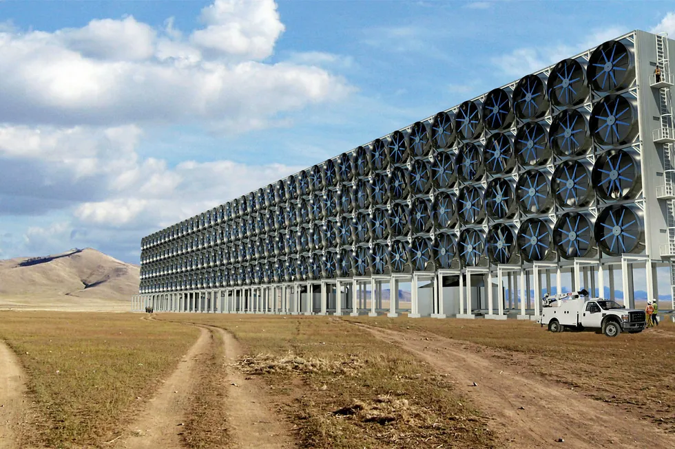 The hardware: A rendering of Carbon Engineering's DAC system scaled up for commercial application. This unit would be one of several that would collectively capture 1 million tpa of CO2. Lower right, research scientist Geoff Holmes
