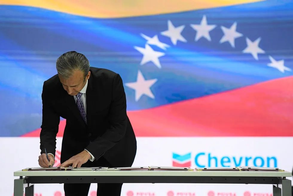 Venezuelan Petroleum Minister Tareck El Aissami signs a document during an agreement signing ceremony with California-based Chevron, in Caracas, Venezuela, in December 2022.