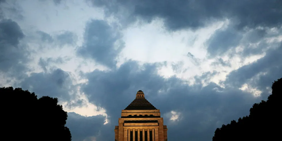 The National Diet building is illuminated during dusk in Tokyo.