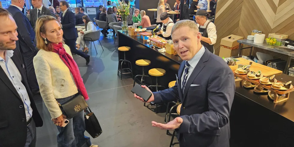 Mowi CEO Ivan Vindheim (right) gives a tour of the company's Barcelona booth to Linda Hofstad Helleland of Norway's Conservative Party.