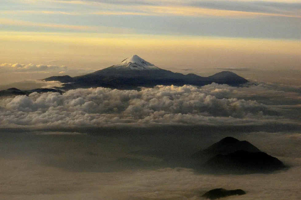 Rising: the Citlaltepetl volcano surrounded by clouds in Veracruz state, Mexico