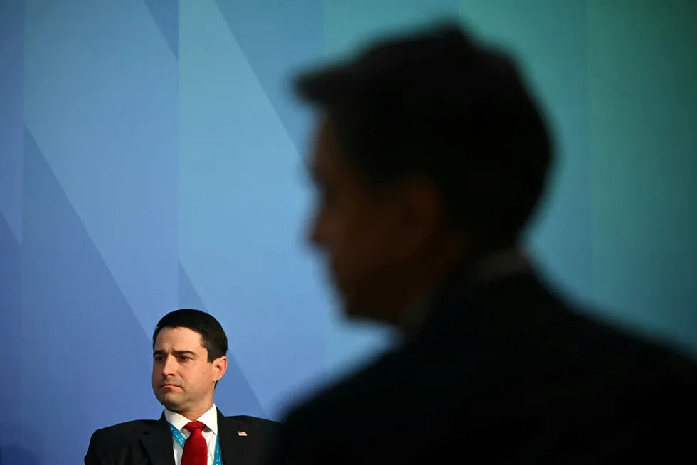 US Acting Assistant Secretary of Energy for International Affairs, Tommy Joyce attends a panel discussion while UK Climate Change and Net Zero Secretary Ed Miliband listens, at the Future of Energy Security Summit, in London on 24 April.