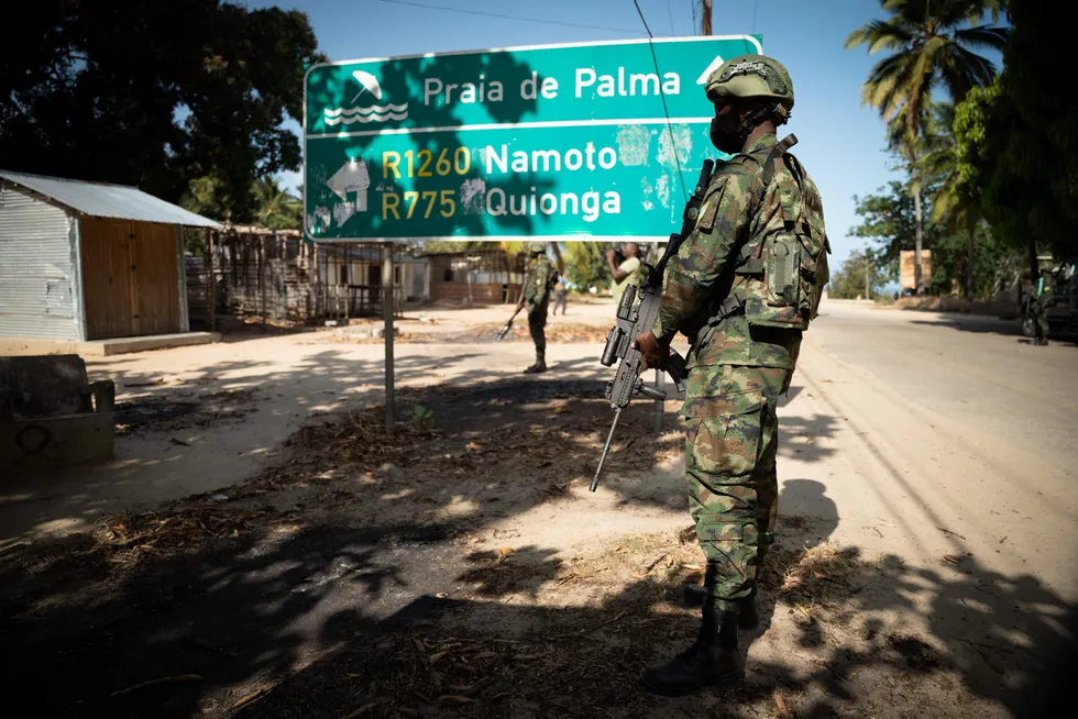 Military success: A Rwandan soldier walks in front of a burned truck near Palma, Mozambique, a town very close to TotalEnergies' Mozambique LNG construction site at Afungi