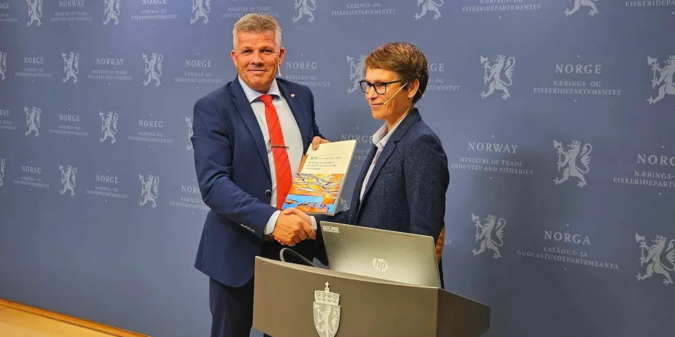 Norway's Fisheries Minister Bjornar Skjaeran and Aquaculture Committee member Linda Nostbakken announce updated regulations on Sept. 28.
