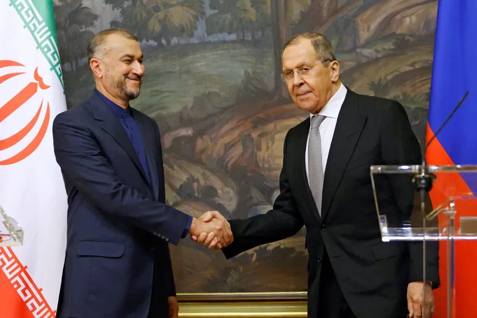 Shaking on it: Russian Foreign Minister Sergei Lavrov shakes hands with Iranian Foreign Minister Hossein Amir-Abdollahian during a joint news conference in Moscow