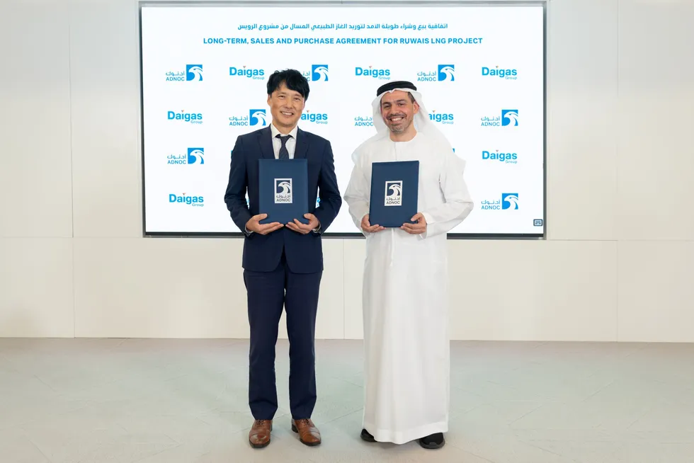 Osaka Gas executive vice president Keiji Takemori (left) and Adnoc senior vice president of marketing Rashid Khalfan Al Mazrouei (right) sign a new long-term gas supply deal.