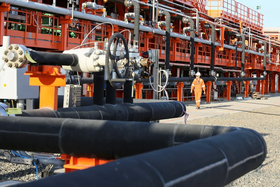 Environmental concerns: A worker walks past infrastructure on D Island at the Kashagan offshore oil and gas field in the Caspian sea in Kazakhstan.