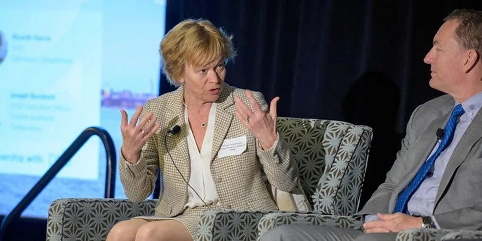 Anne Hvistendahl, Global Head of Seafood at DNB, speaks at the 2022 IntraFish Boston Seafood Leadership Breakfast. On the right is Trident Seafoods CEO Joe Bundrant.