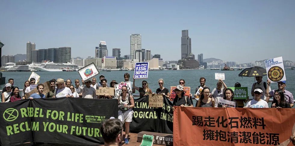 Protesters hold signs and chant slogans during the Hong Kong Climate Strike rally on September 20, 2019 in Hong Kong, China.