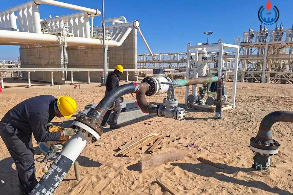 Workers at Zallaf's Chadar oilfield in Libya.
