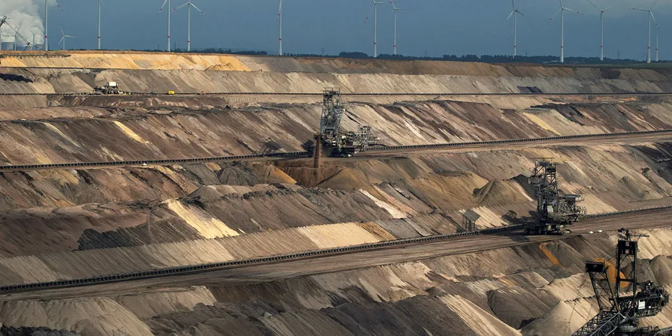A giant excavator and mining machinery operate at an open pit lignite mine, also known as brown coal, operated by RWE AG in Hambach, Germany, on Monday 7, Sept. 2015. German utilities including RWE, unions and the states, successfully fended off a plan by Chancellor Angela Merkel's government this summer to fast-track lignite power plant closures to help Germany meet its climate goals. Photographer: Jasper Juinen/Bloomberg via Getty Images RWE. RWE.
