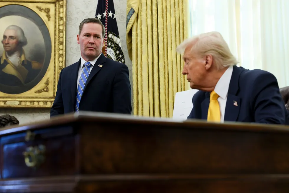 White House National Security Adviser Mike Waltz (left) listens as President Donald Trump speaks in the Oval Office of the White House in March.