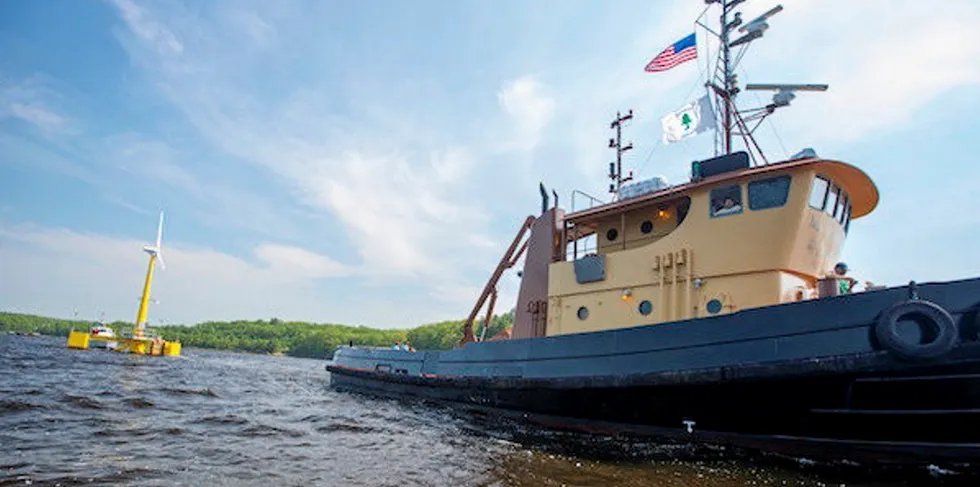 The VolturnUS 1:8 floating wind prototype being towed out in 2013