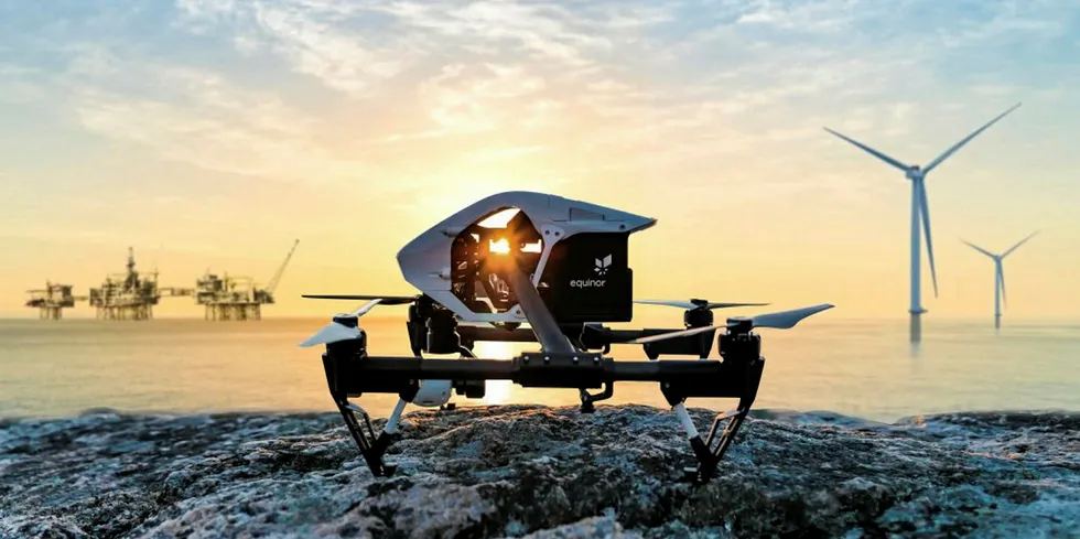 CGI of drone with offshore oil platforms and wind farm in the distance