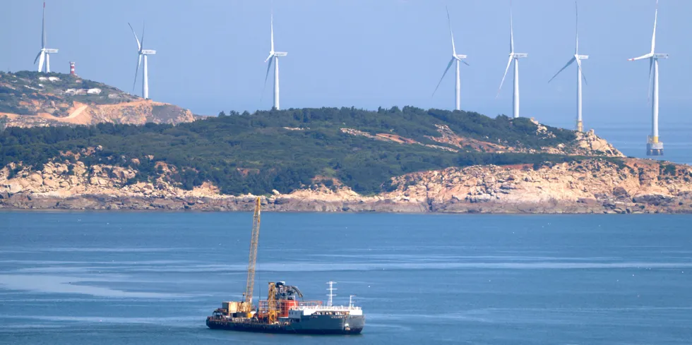 Wind turbines line the coastline of Pingtan in southern China’s Fujian province.