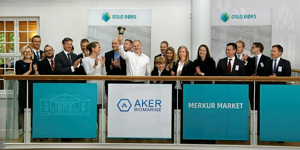 Aker Biomarine CEO Matts Johansen and his team ring the bell at the Oslo Stock Exchange's Merkuk Market. Aker Biomarine CEO Matts Johansen and his team ring the bell at the Oslo Stock Exchange's Merkuk Market.