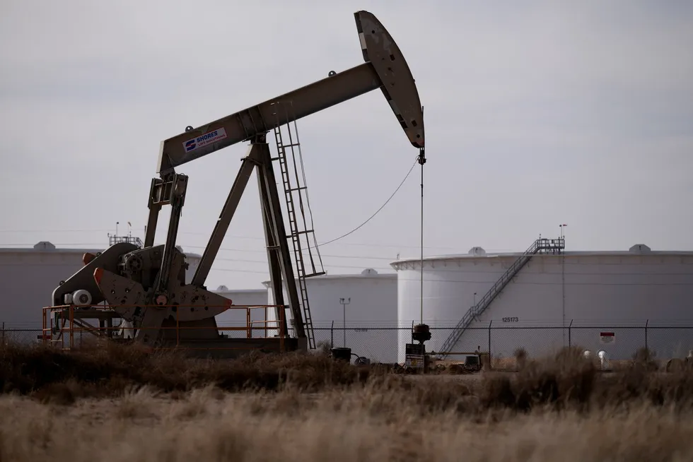 A pump jack operates near a crude oil reserve in the Permian basin.