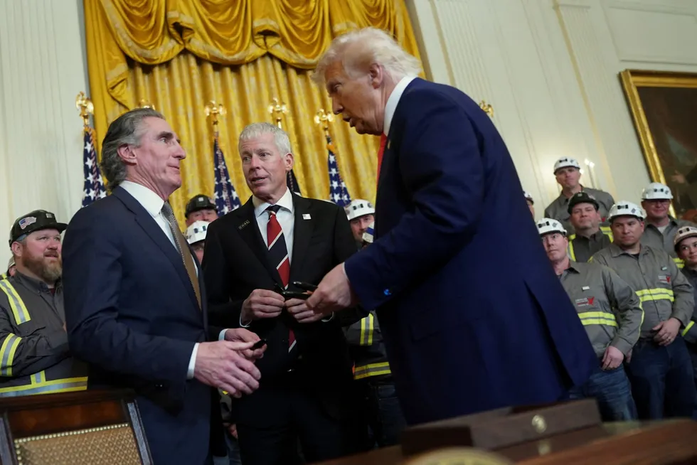 US President Donald Trump talks to Secretary of the Interior Doug Burgum and Secretary of Energy Chris Wright after he signed energy-related executive orders at the White House in Washington, DC, US, on 8 April 2025.