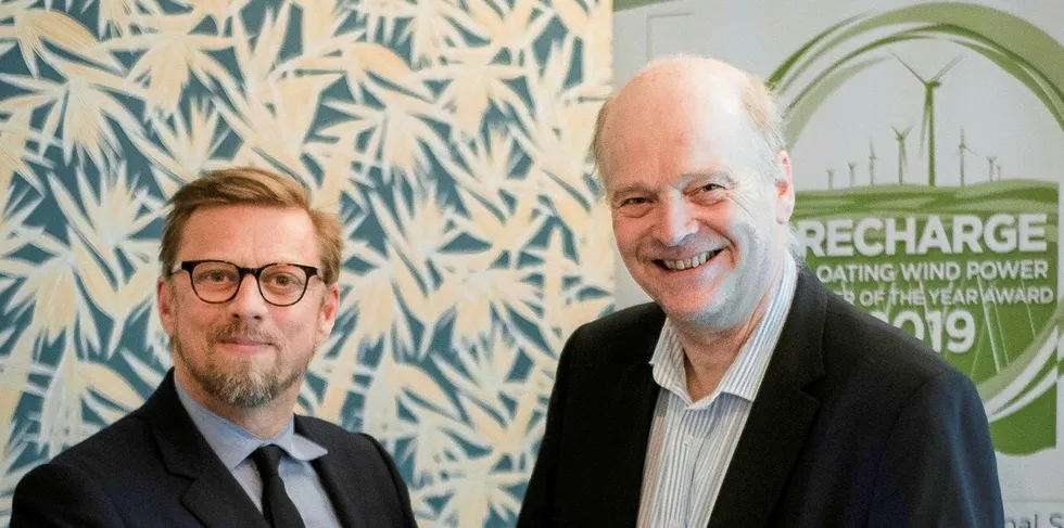 Henrik Stiesdal receives his award from Recharge Editor-in-Chief Darius Snieckus |