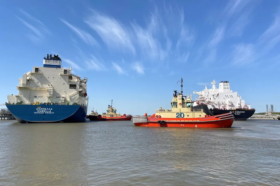 An LNG carrier is guided by tugboats at the Cheniere Sabine Pass LNG export facility in Cameron Parish