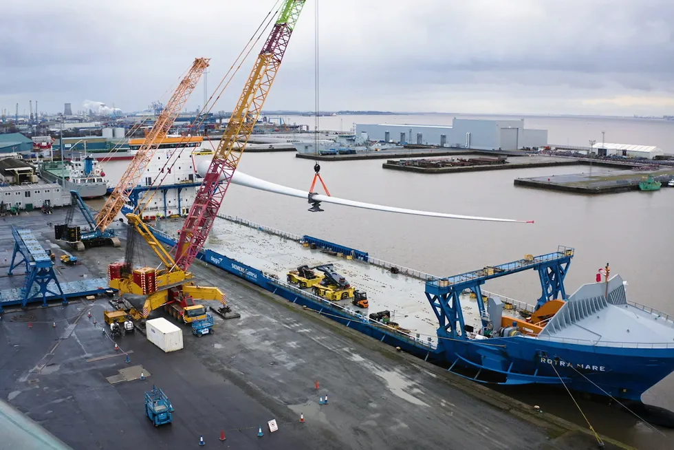 A Siemens Gamesa 108-metre blade being loaded on a transport vessel at Hull bound for Moray West.