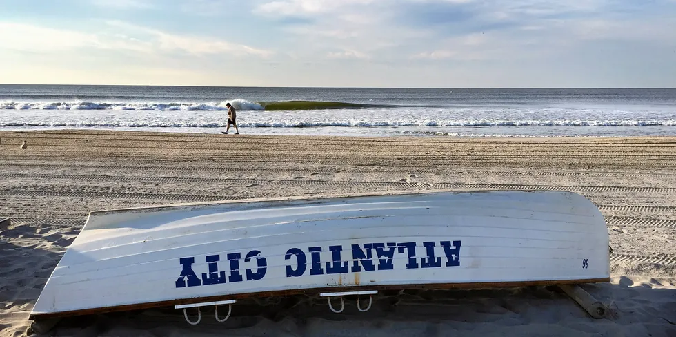 New horizons for offshore wind. A lifeguard rescue boat lies on the beach in Atlantic City, New Jersey.