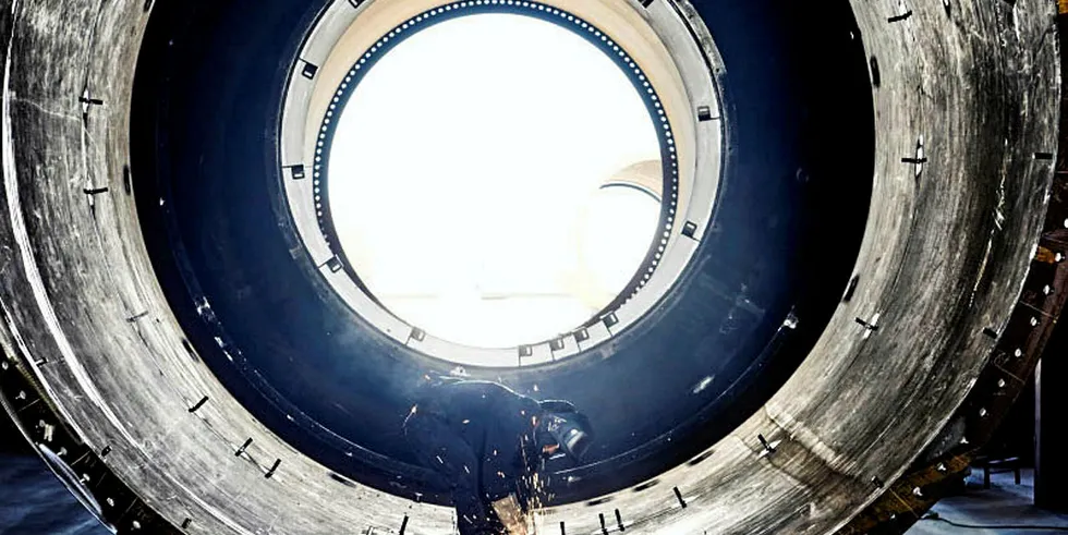Technician welding inside Welcon tower piece