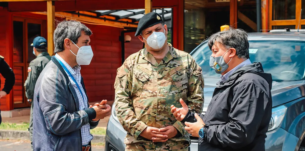 Chilean officials at an inspection of Quellon salmon processing plants.