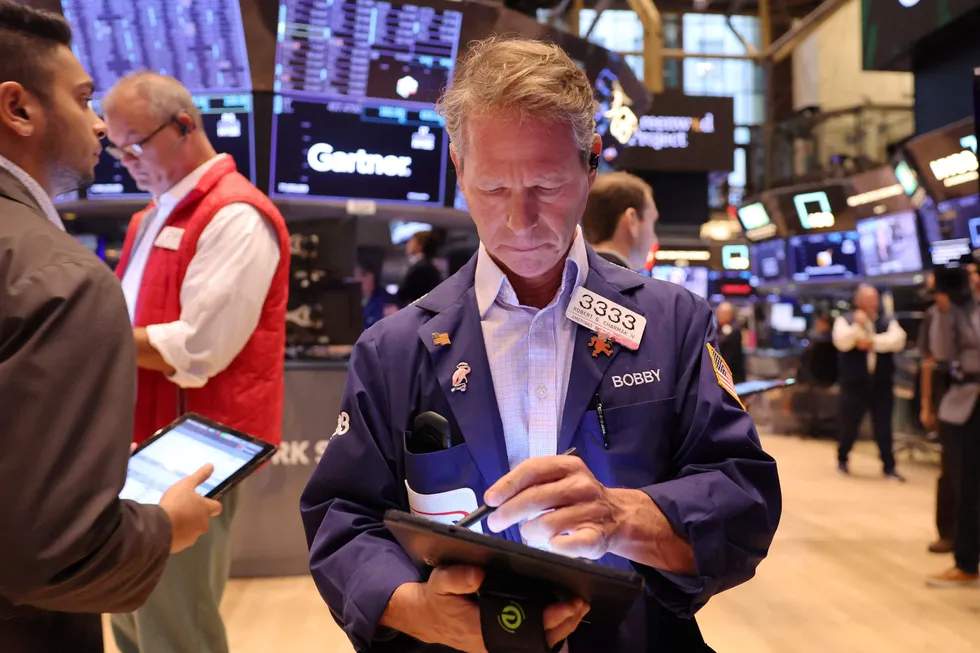 Traders work on the floor of the New York Stock Exchange.