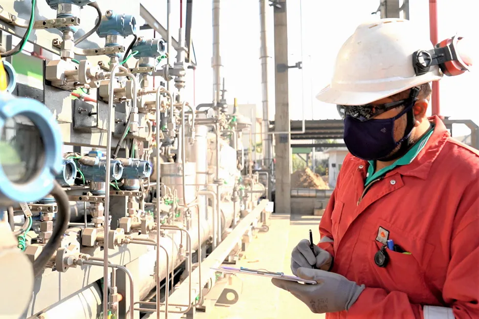 A worker at Shell's Hazira LNG terminal in India.