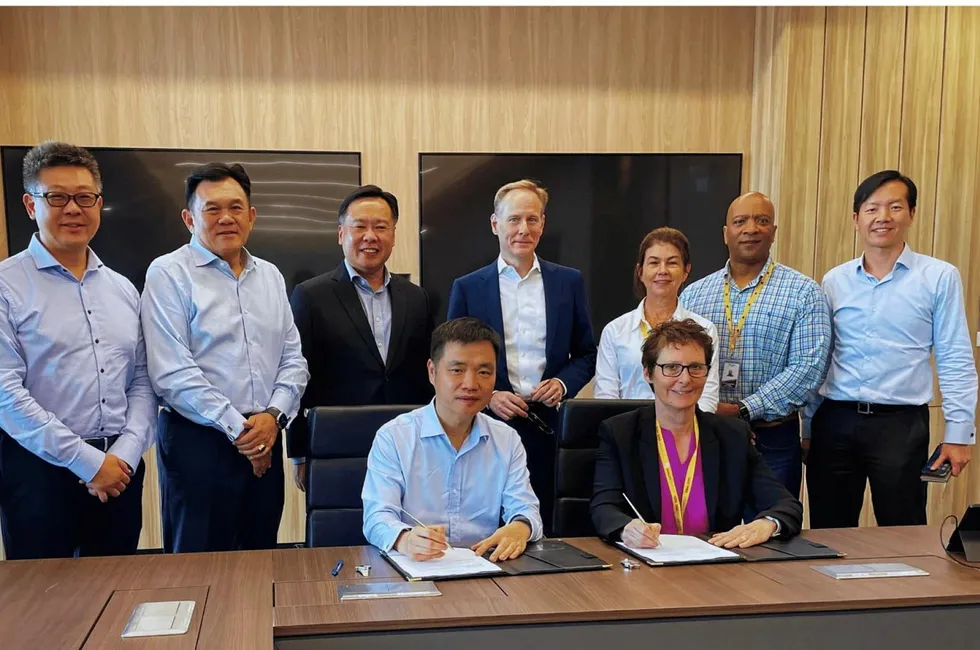 Signing: Shell and Seatrium officials sign the MoU
