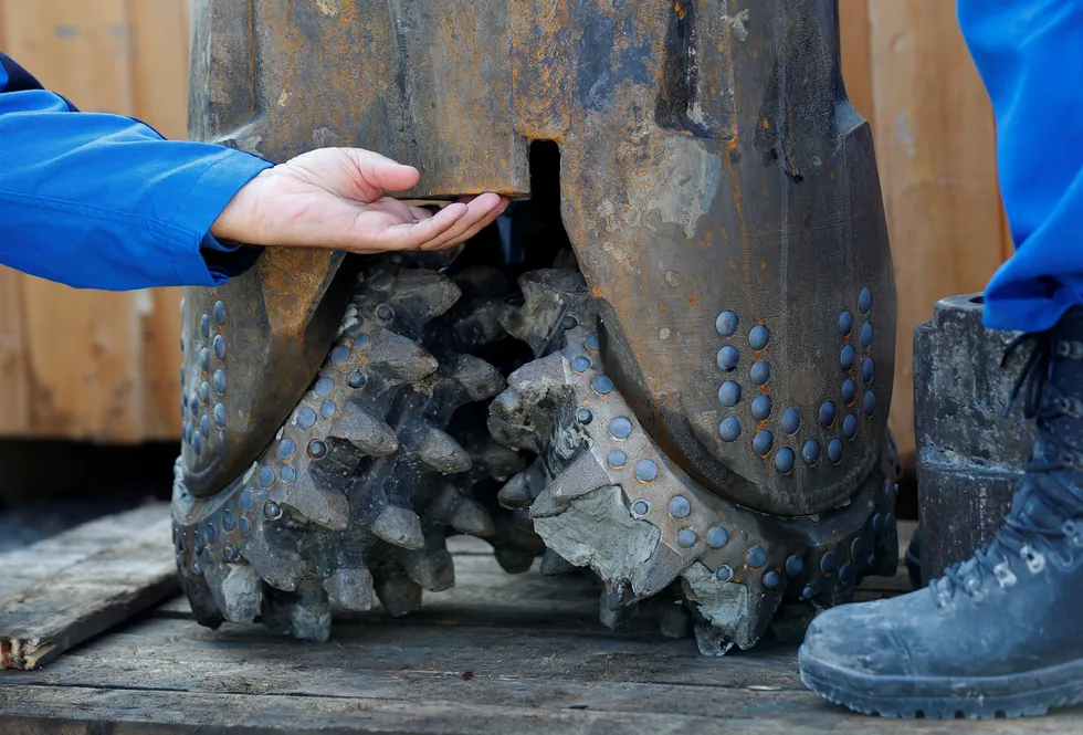 Switch: a worker adjusts a drillbit on an oil rig. The NZAOA has called on its members to stop direct investment in new upstream oil and gas projects.