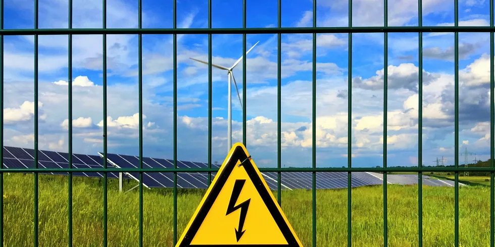 A warning sign outside a solar/wind facility in Germany