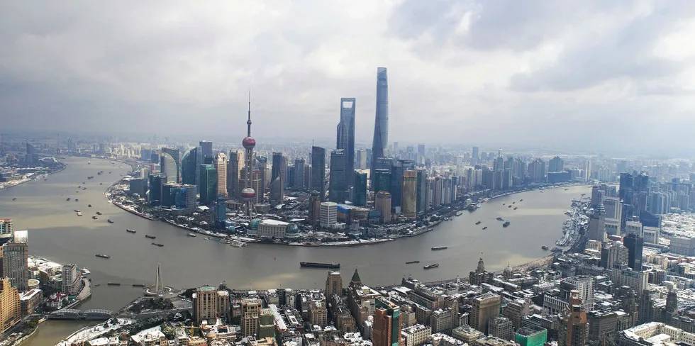 This aerial photograph shows snow on rooftops in Shanghai on January 26, 2018.