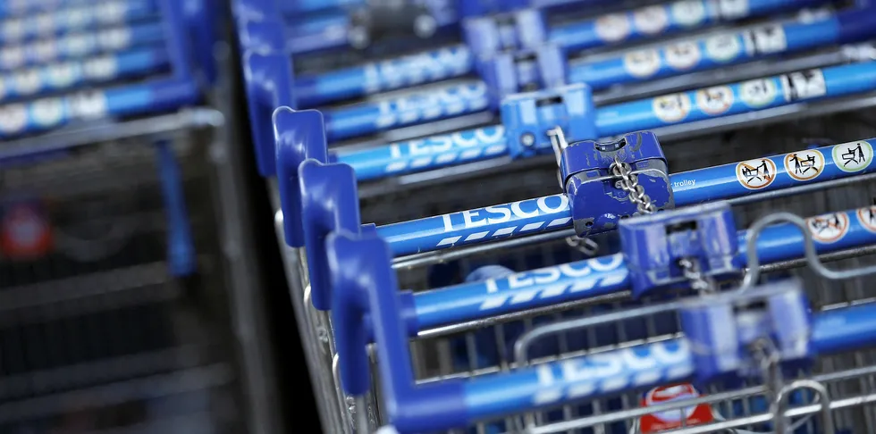 Shopping trolleys are pictured outside a Tesco supermarket in London