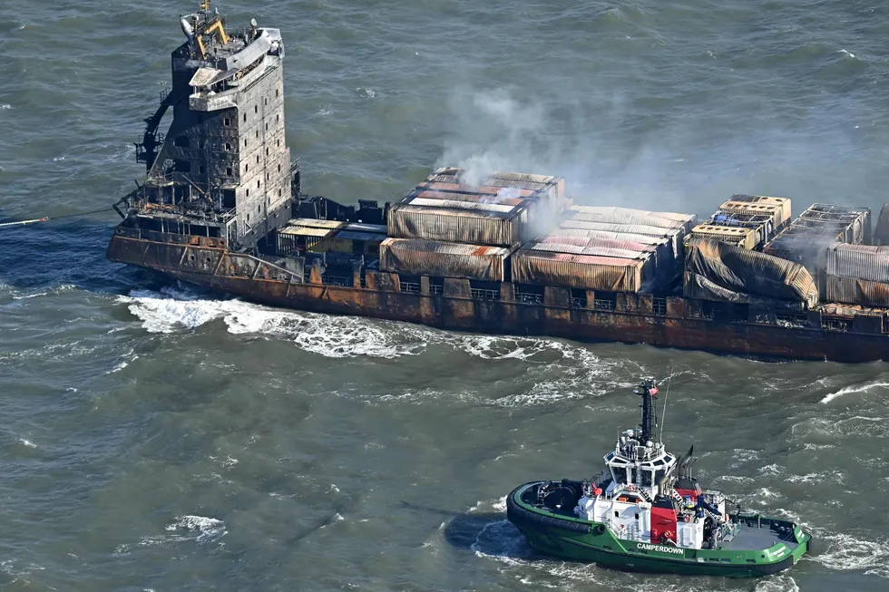 Smoke rises from damaged containers on the deck of the Solong, in the North Sea, on Tuesday after it collided with the tanker Stena Immaculate on Monday.