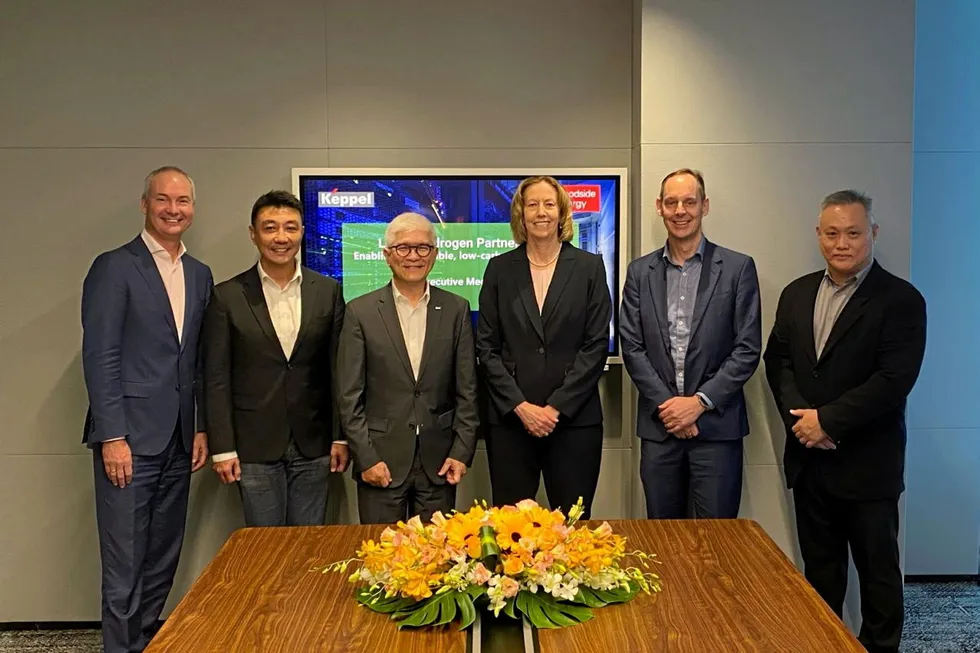 Executives from Keppel and Woodside Energy including Wong Wai Meng (second from left) and Meg O'Neill (fourth from left).