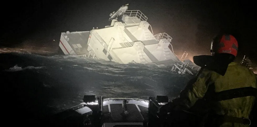 Laxar's salmon feed barge is seen sinking near Reydarfjordur, Iceland.
