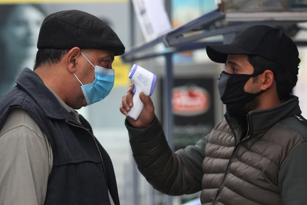 Safety first: A shopper gets his temperature checked before entering a supermarket in the Iraqi capital Baghdad amid the Covid-19 pandemic