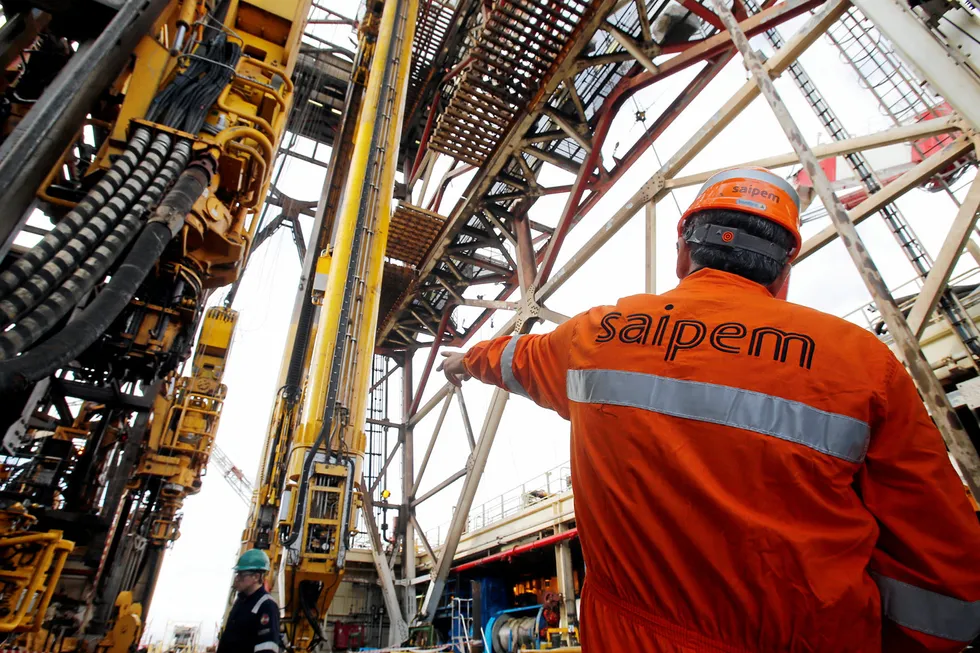 In dock: a staff member gestures on the deep-water drillship Saipem 10000