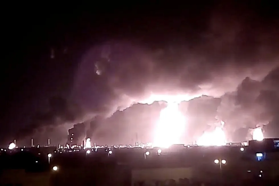 Attack: fires burn in the distance after a drone strike Aramco's oil processing facilities, in Buqayq, Saudi Arabia, over the weekend