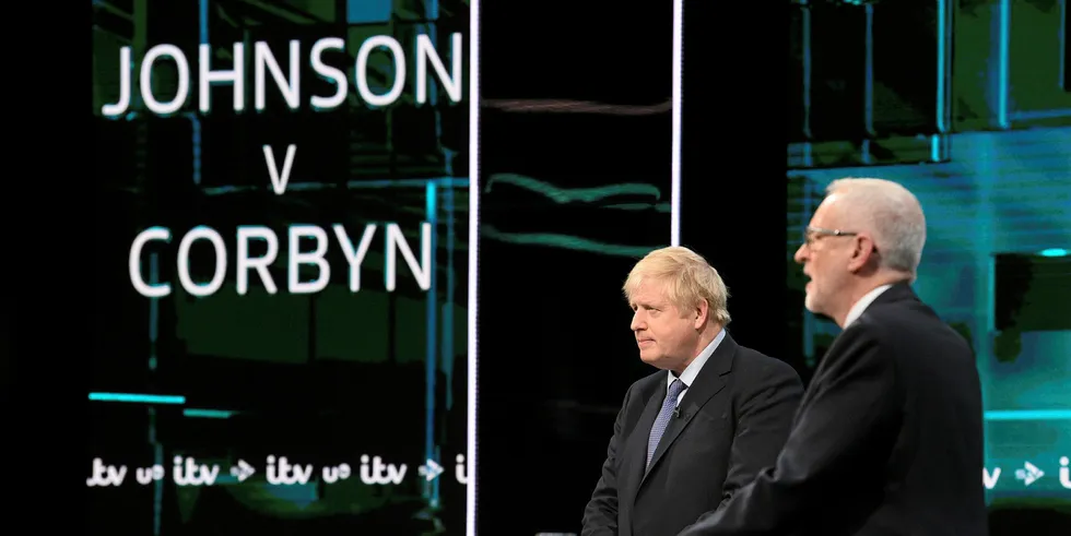 Prime Minister Boris Johnson (left) and Leader of the Labour Party Jeremy Corbyn answer questions during the ITV Leaders Debate at Media Centre on November 19, 2019 in Salford, England.