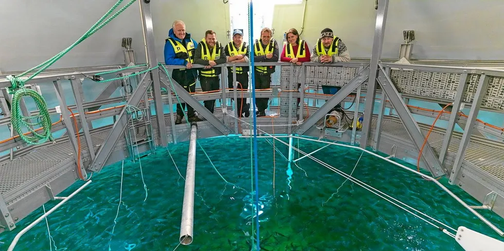Key executives behind The Egg closed containment salmon farm as the first smolt are put in the water.