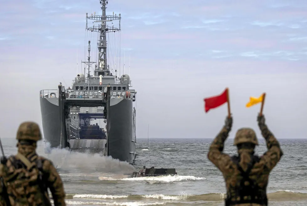 Infantry combat vehicle arrive ashore after leaving Polish Navy warship ORP Torun during military drills of Polish and NATO soldiers near the Vistula Spit canal, near Krynica Morska, northern Poland.