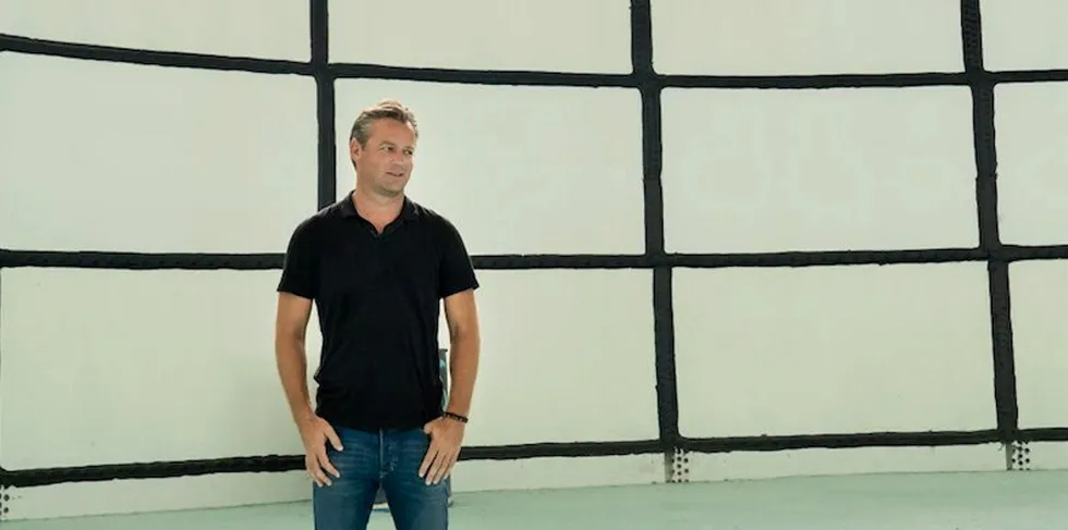 Atlantic Sapphire CEO Johan Andreassen standing inside a tank at the company's Florida Bluehouse land-based salmon facility.
